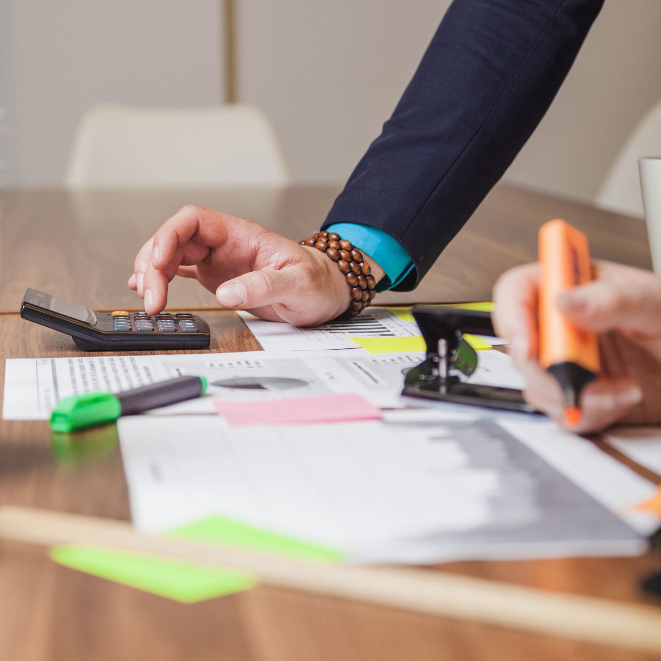 people-standing-leaning-desk-working